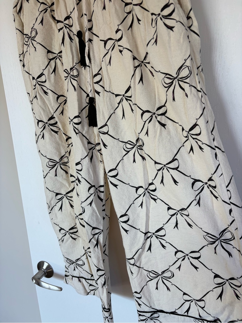 Cost Plus World Market Cream Wide-Leg Drawstring Pants with Black Bow Print
